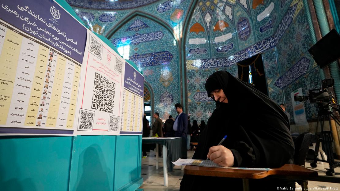 Iran began voting Friday with questions looming over just how many people will turn out for the poll