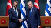 Greek Prime Minister Kyriakos Mitsotakis (left) and Turkey's President Recep Tayyip Erdoğan shake hands in front of two lecterns and a row of Turkish and Greek flags after a press conference at the Presidential Palace, Ankara, Turkey, 13 May 2024