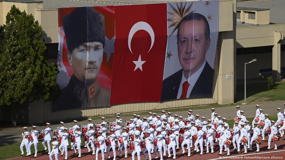 Mustafa Kemal Ataturk (left) and Recep Tayyip Erdogan (right) displayed on banners during a naval display in Istanbul