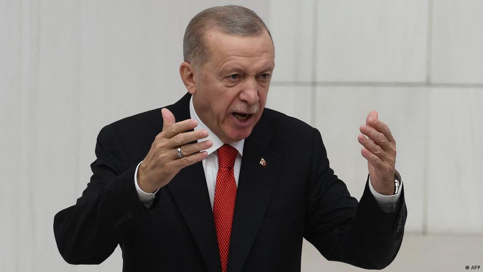 Turkish President Recep Tayyip Erdogan gesticulates during a speech to parliament