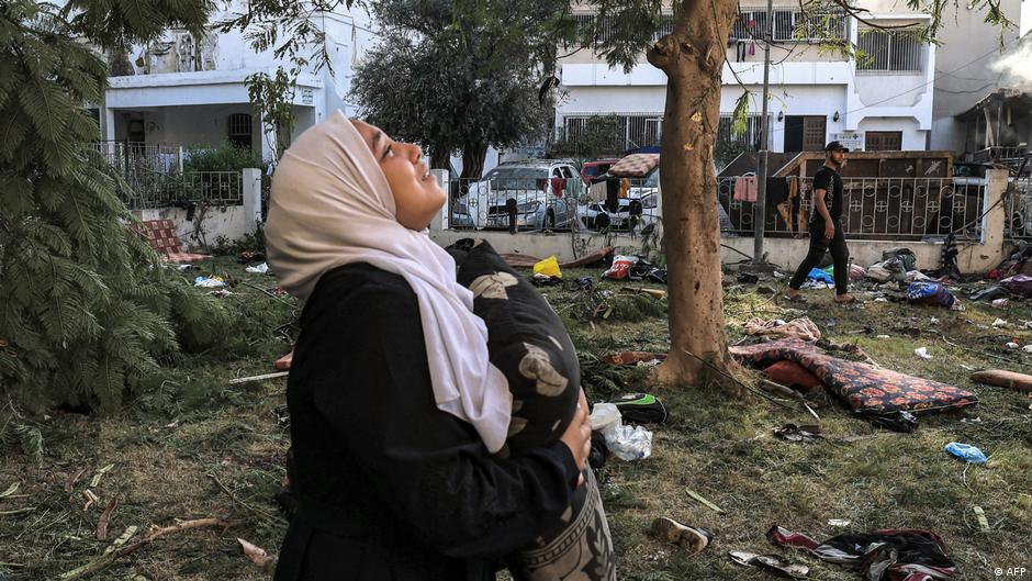 Woman grieves following the strike on the Ahli Arab Hospital in the Gaza Strip