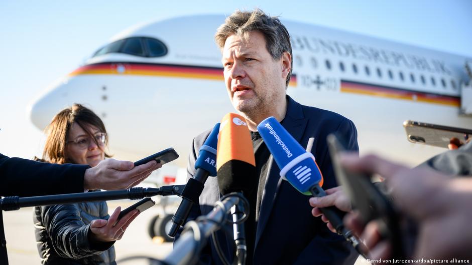 German Trade and Environment Minister Robert Habeck gives a statement at Berlin Brandenburg airfield before departing for Doha, Qatar