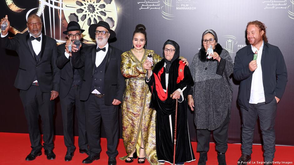 Director Asmae El Moudir (in gold) and her family line up for a photo on the red carpet at the Marrakesh Film Festival