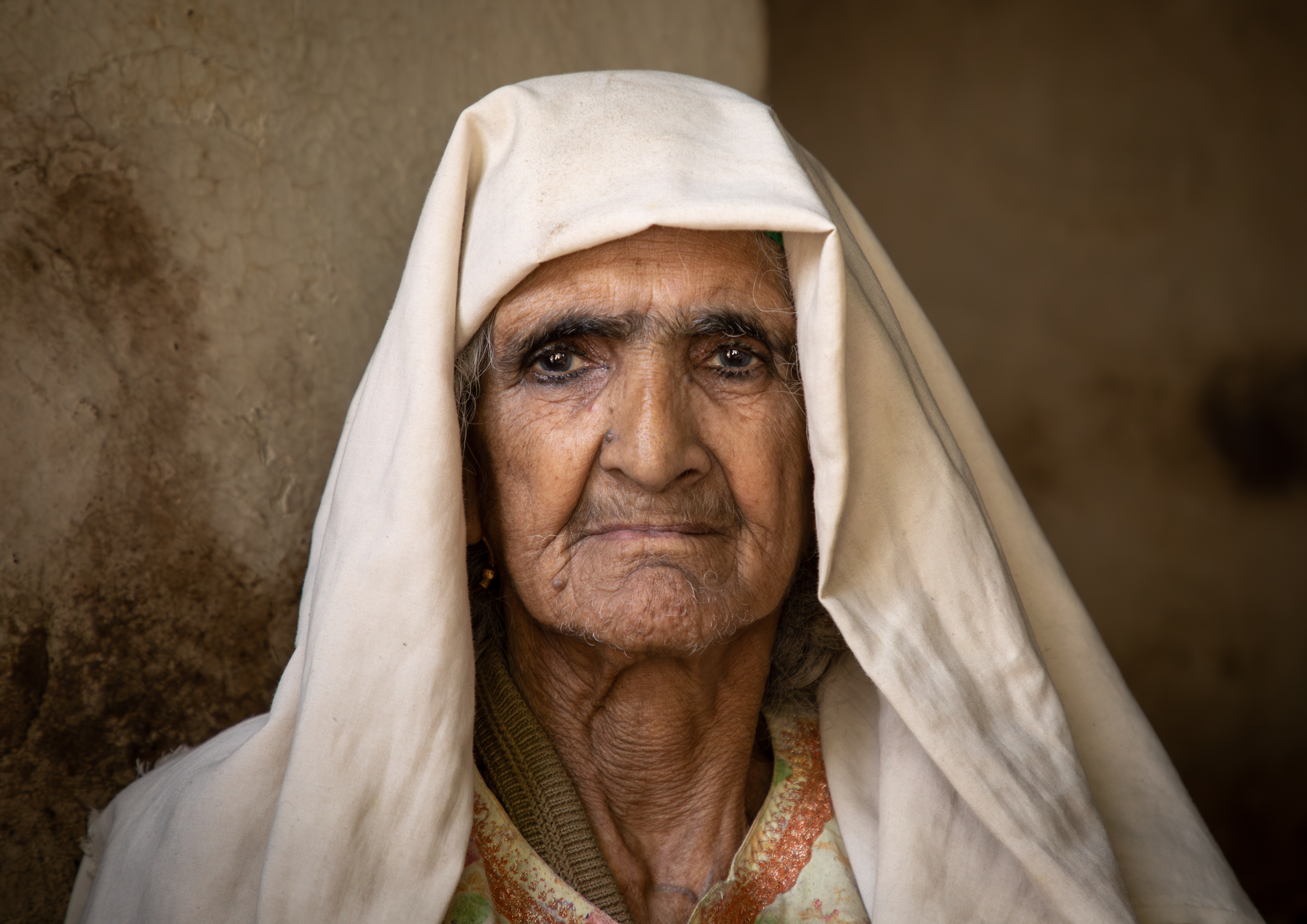 Portrait of an old Kashmiri woman wearing a headscarf