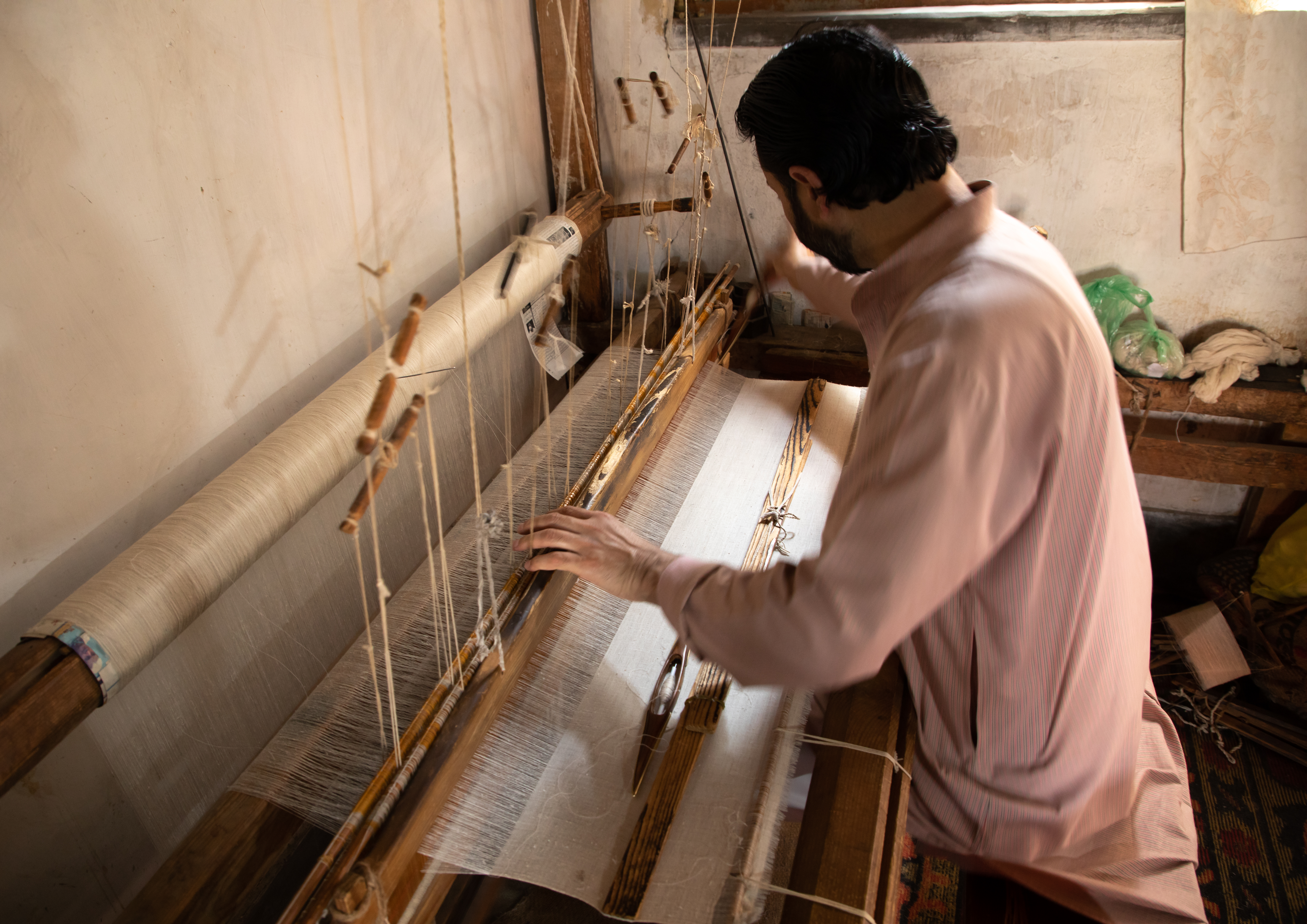 A Kashmiri weaver at his loom