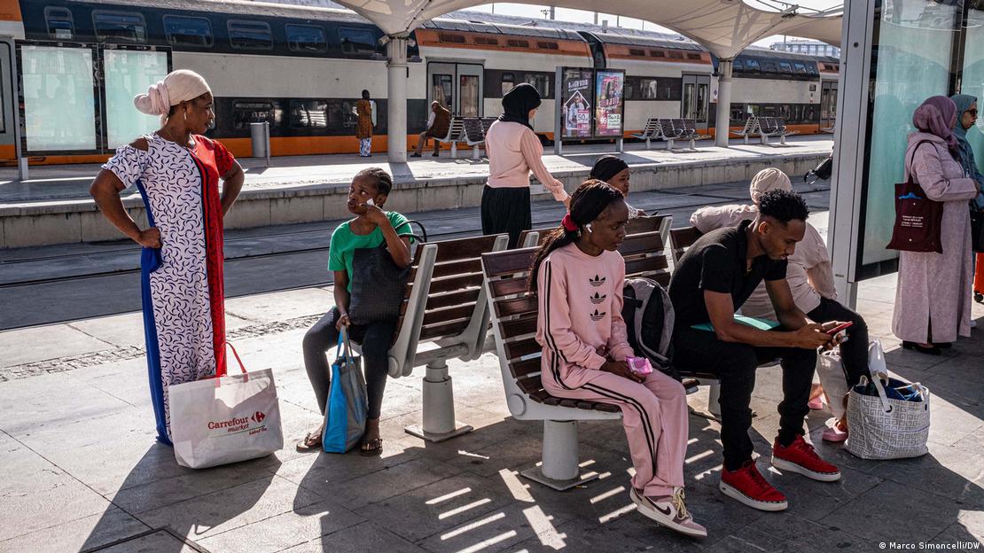 Migrant women wait at the new railway station in Casablanca