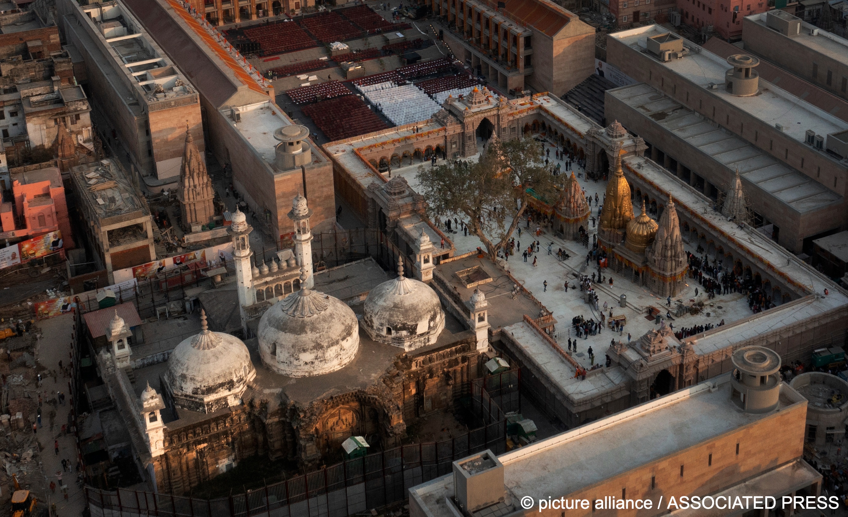 An aerial view shows Gyanvapi Mosque, left, and Kashi Vishwanath Temple on the banks of the Ganges river in Varanasi, India
