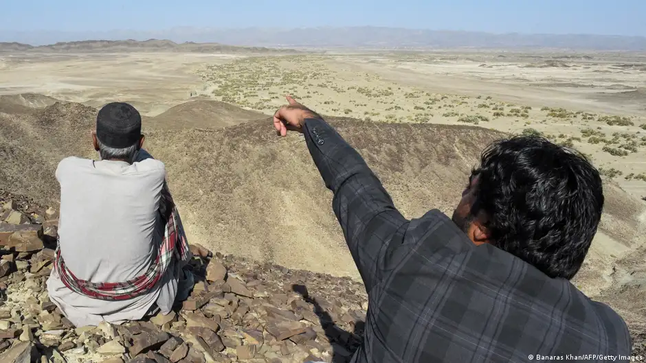 A Baloch man points to where the Iranian army carried out an airstrike against alleged separatists in Pakistan