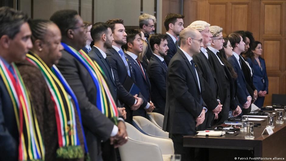 South African delegation (left) and Israeli delegation (right) stand during session at the International Court of Justice