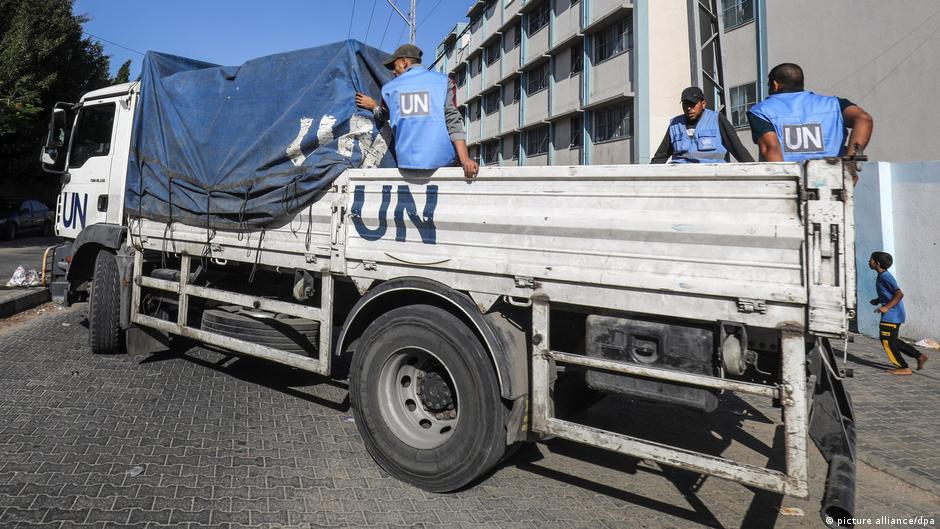 A UN lorry transports food for Palestinian citizens housed in one of the schools run by the United Nations Relief and Works Agency for Palestine Refugees in the Near East (UNRWA)
