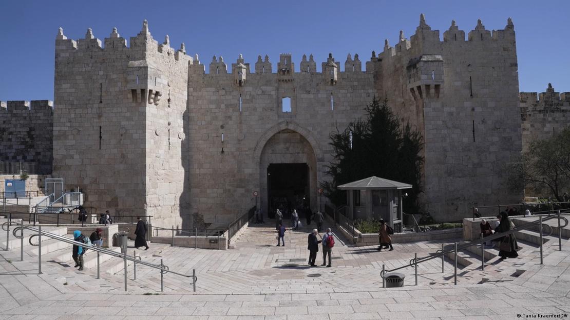 People are seen standing near the Damascus Gate