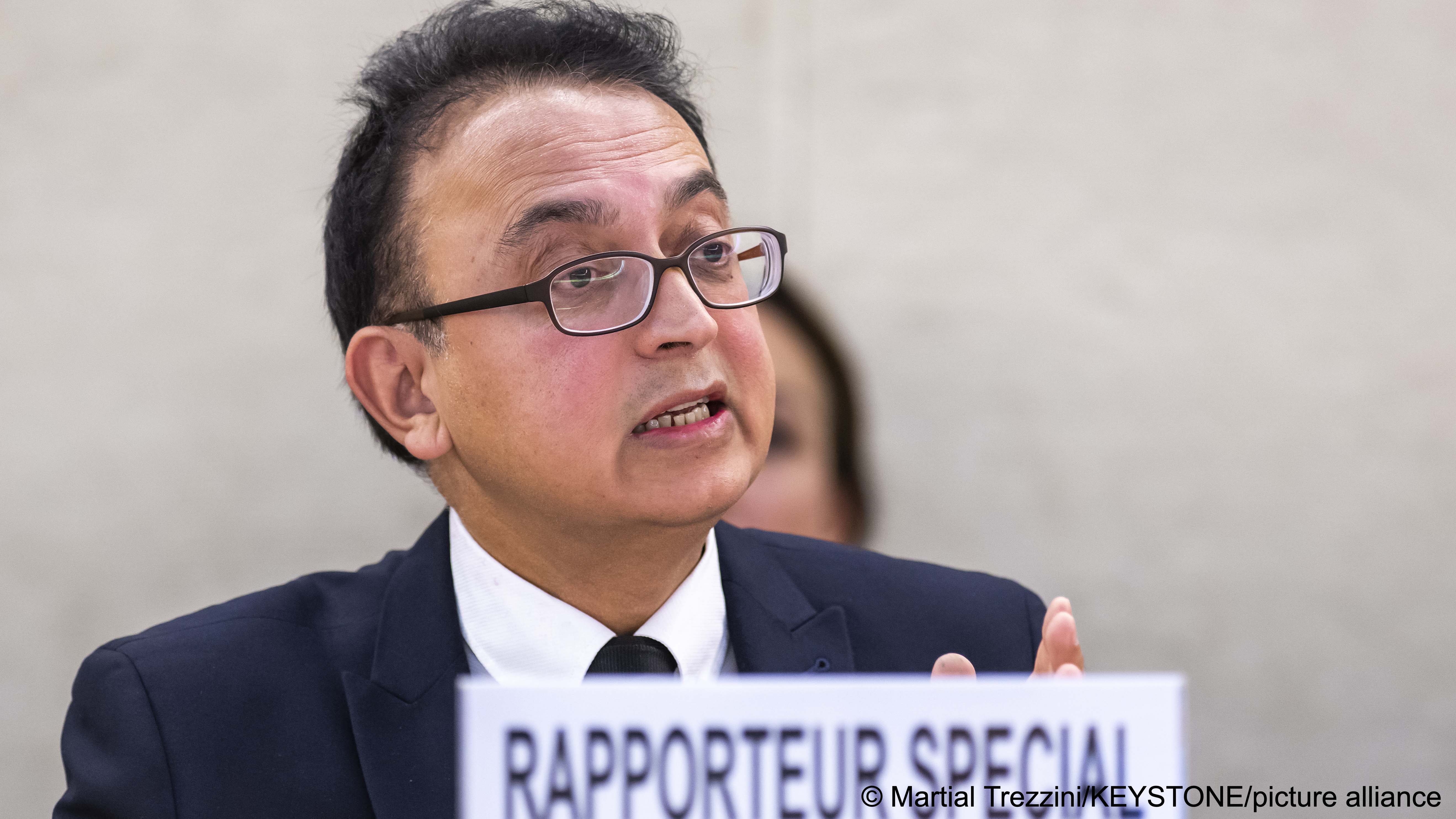 Javaid Rehman, Special Rapporteur on the human rights situation in the Islamic Republic of Iran, gestures as he speaks