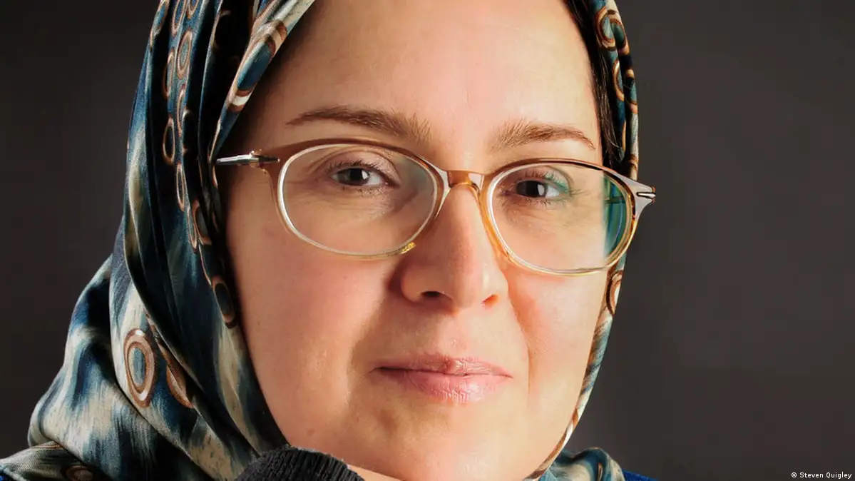 Headshot of a women (Sedigheh Vasmaghi) wearing glasses and a headscarf