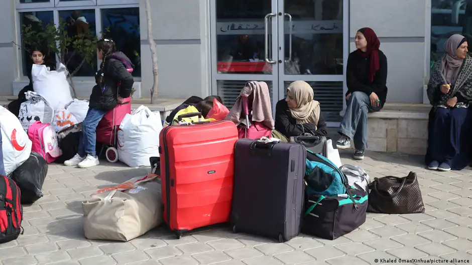 People waiting at the Rafah border crossing
