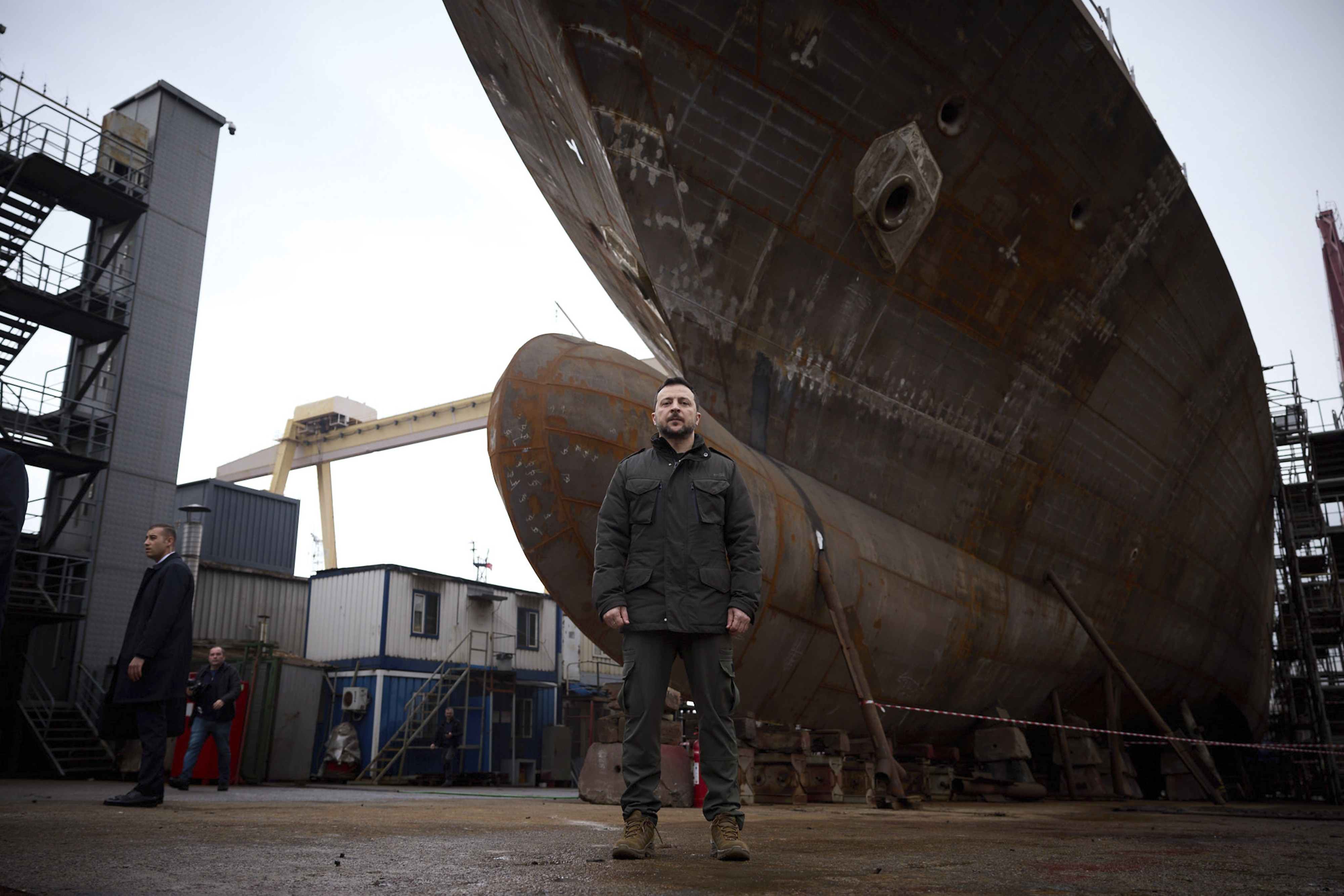 Ukrainian President Zelensky poses in front of a navy ship