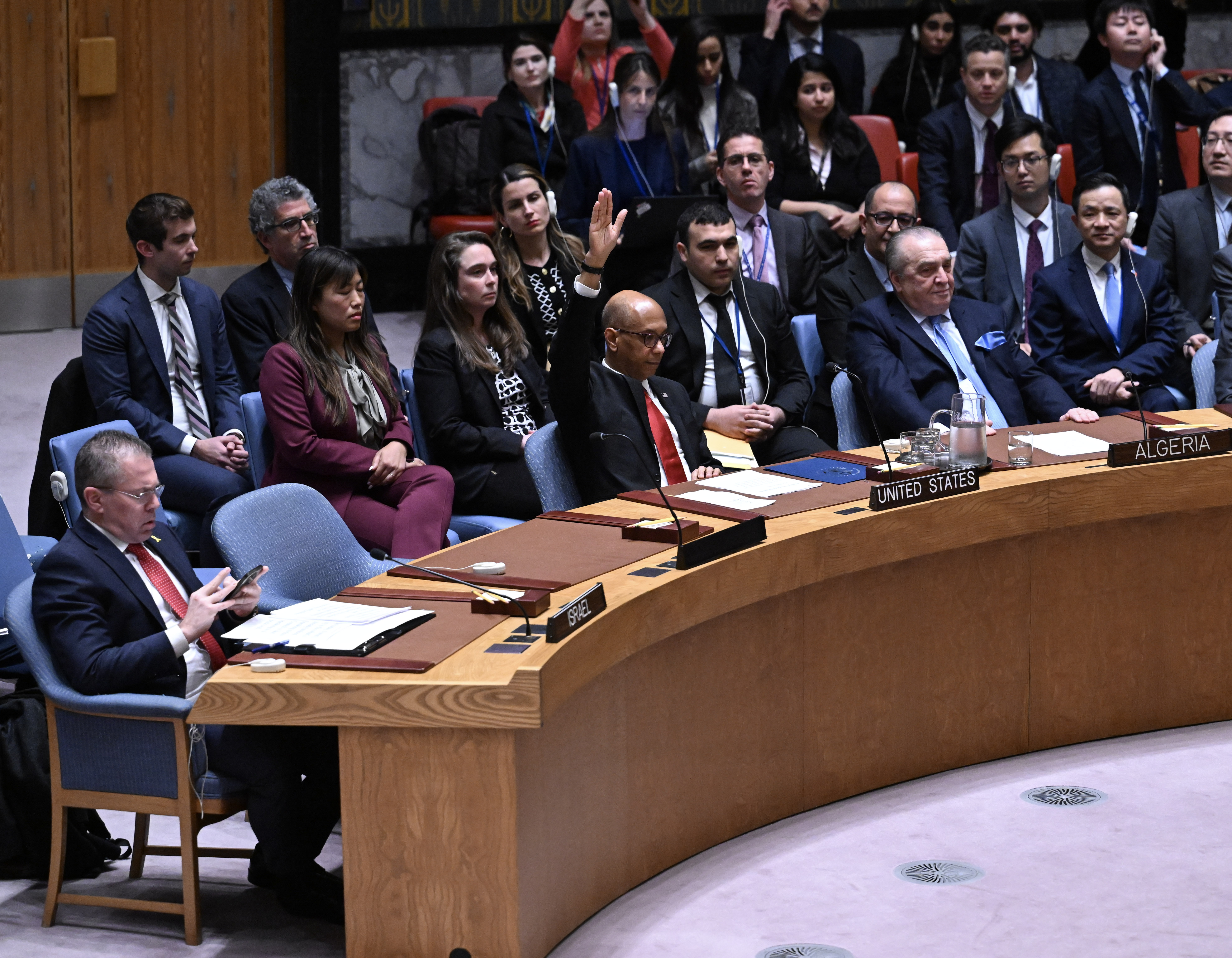 Meeting of the UN Security Council in New York. You can see a section of participants and the US representative raising his hand to veto the decision.