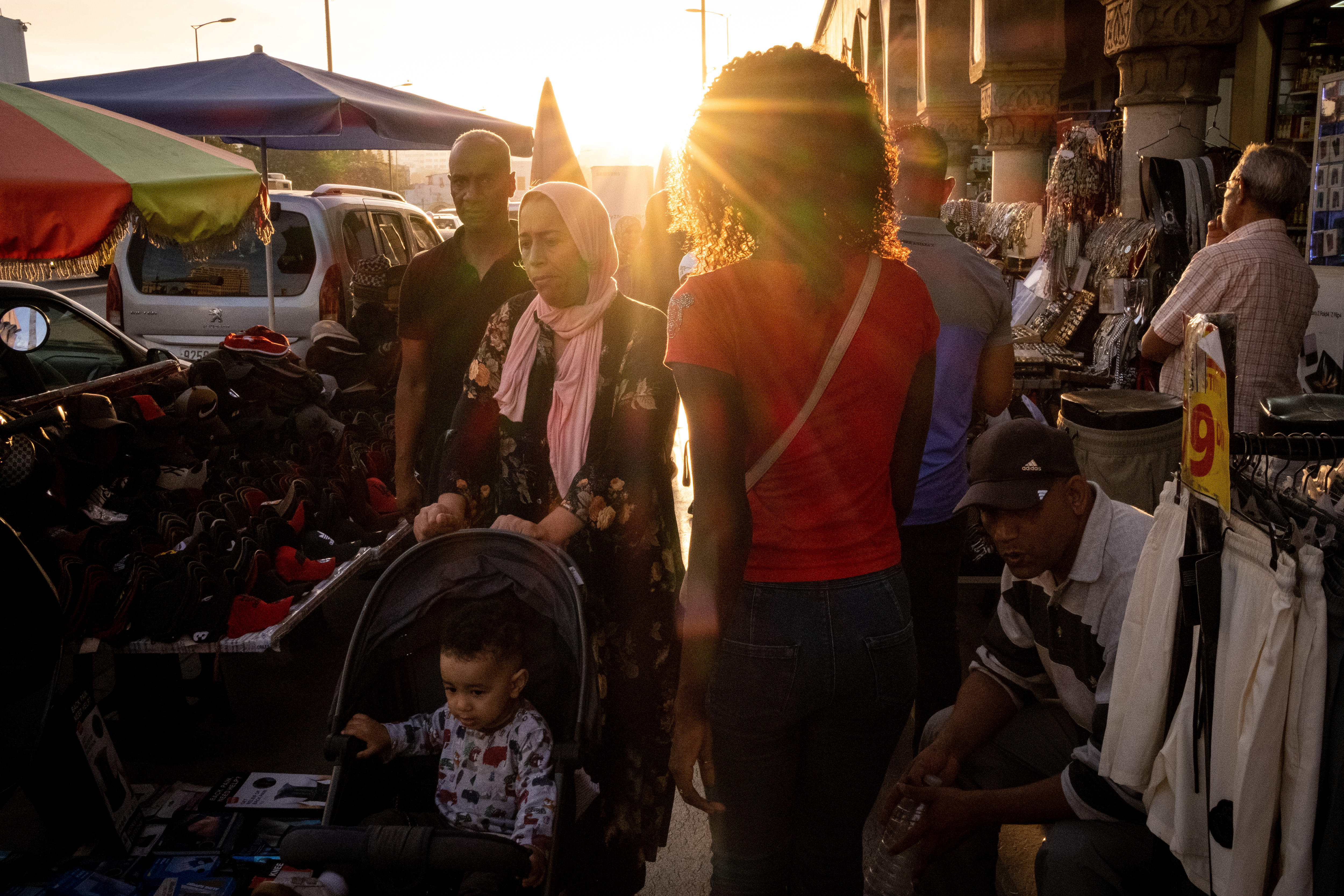 A family walks through a market