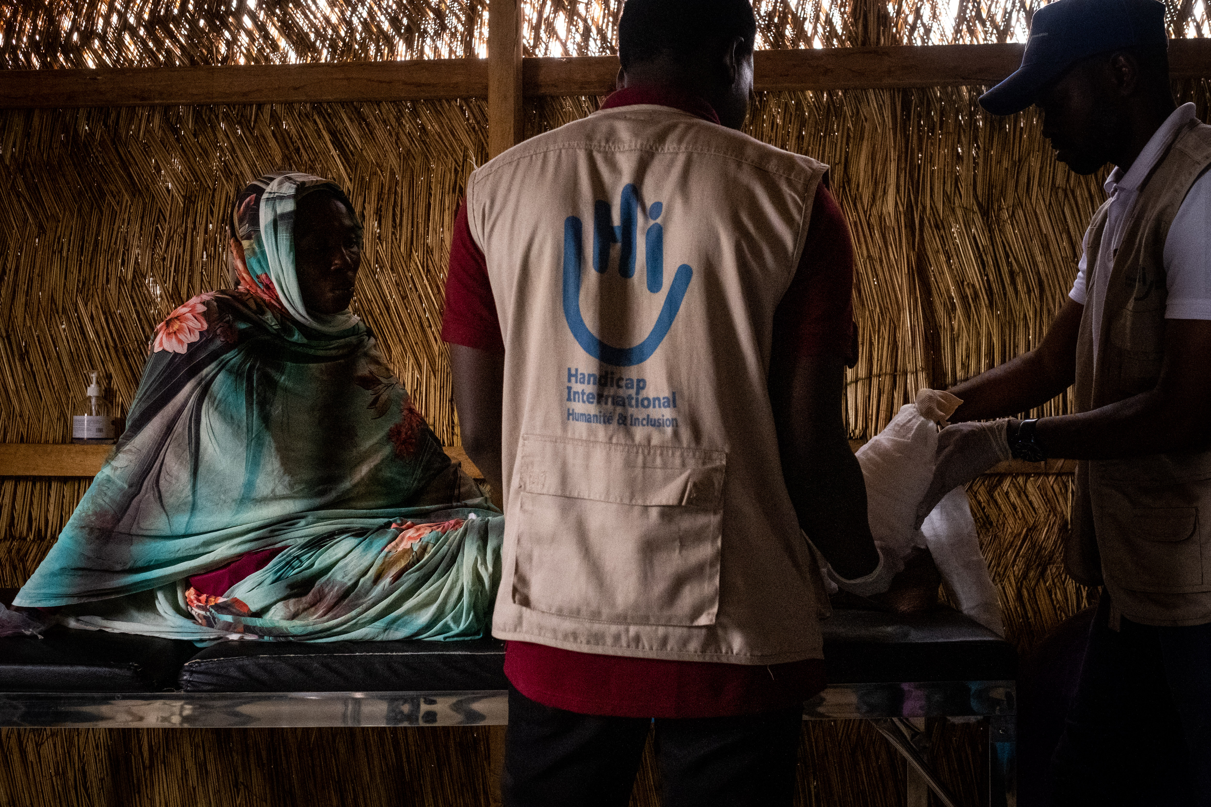 A woman receives treatment at HI's rehabilitation centre in Aboutengue camp.