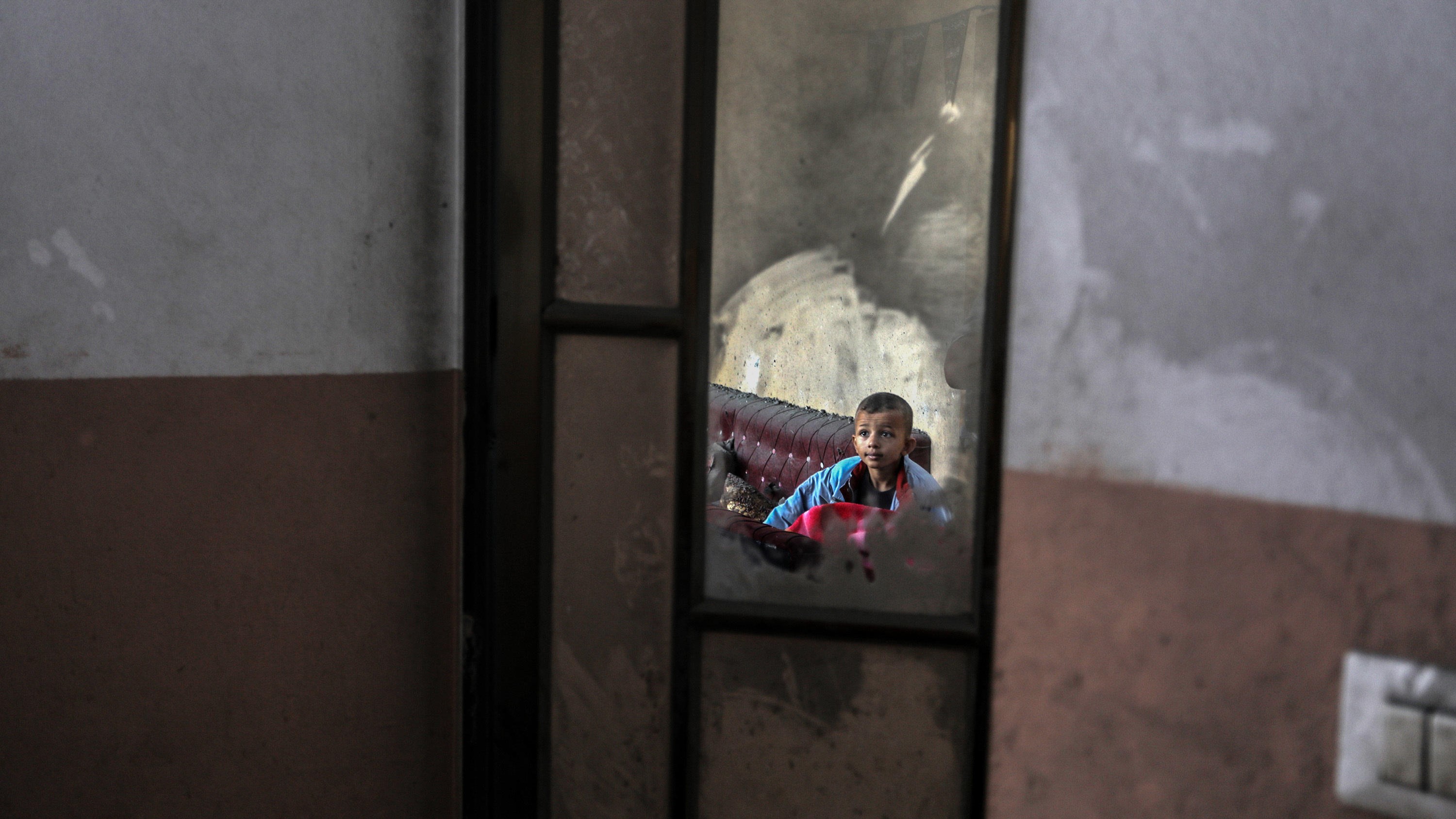 A little child, photographed in a dirty mirror