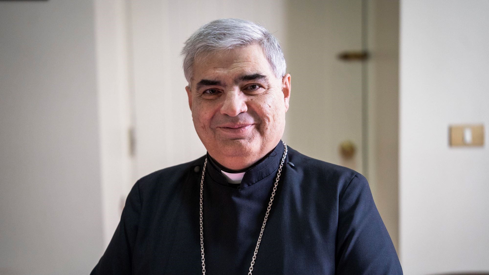 Portrait of Armenian bishop in black habit and cross necklace.