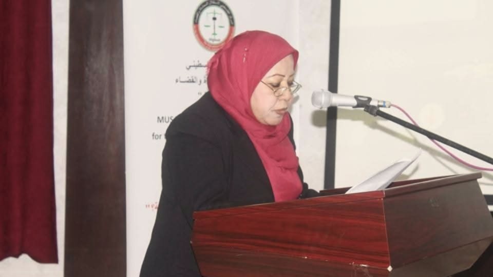 A woman speaks at a podium