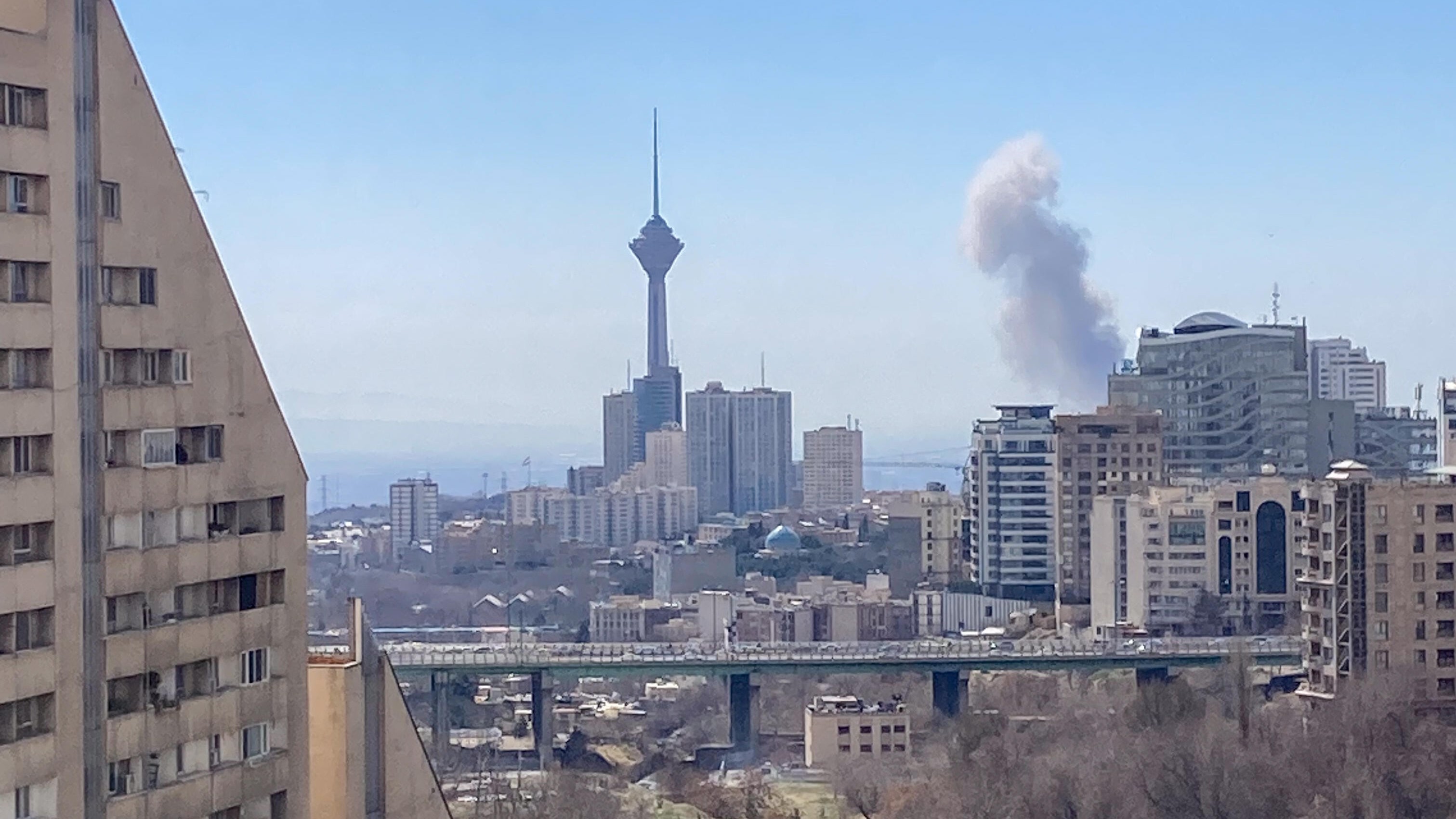 Plumes of smoke rise following reported explosions in Tehran on March 1, 2026. (Photo: picture alliance / Middle East Images | Fariba)