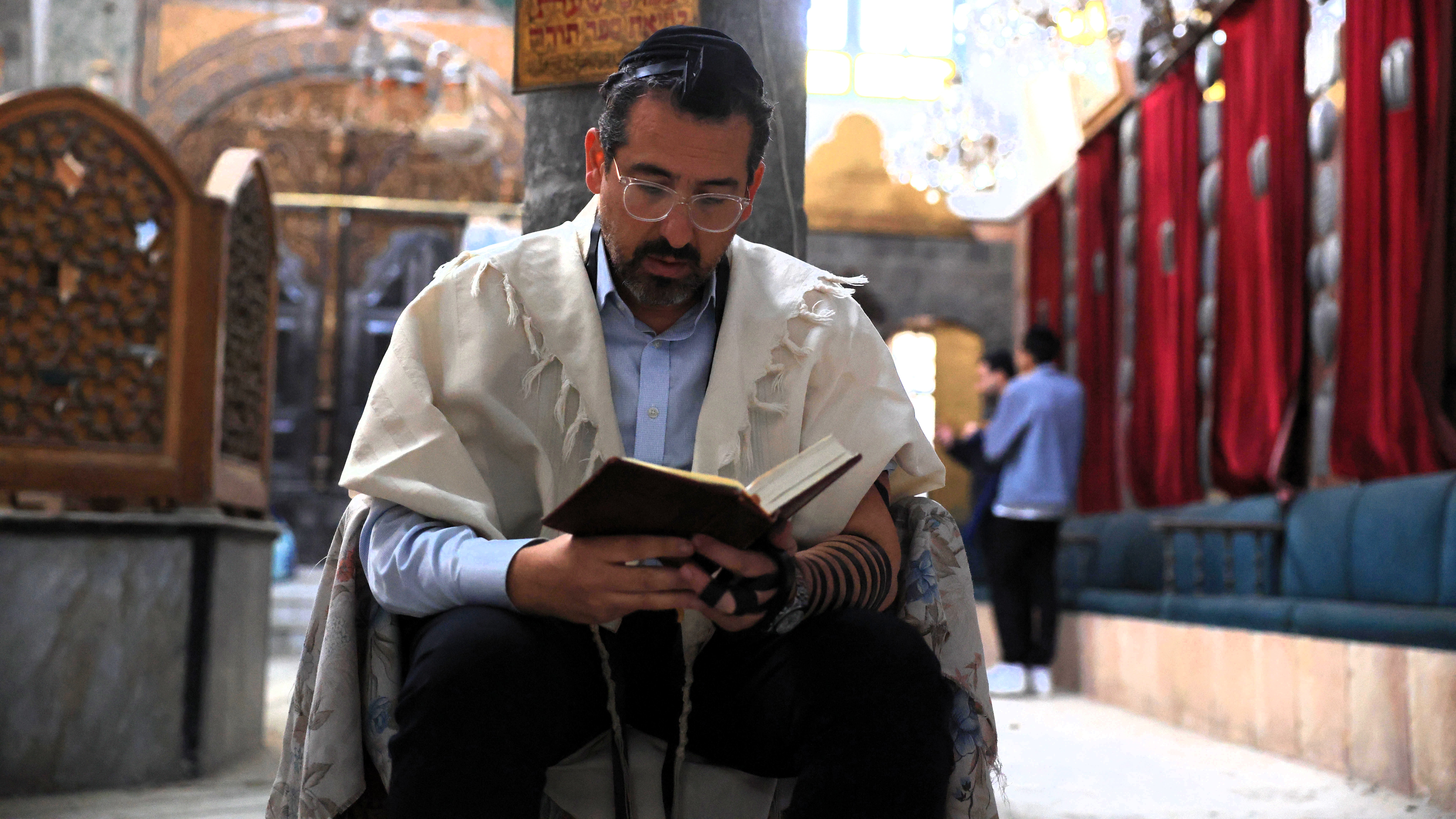 Association President Rabbi Henry Hamra, a Jew from Damascus, performs a prayer as he receives the charter of Jewish Heritage Association, established for the first time in Syria to protect Jewish cultural assets, officially register them, and restore synagogues in Damascus, on December 10, 2025.