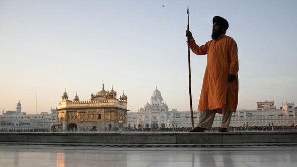 A Sikh standing in front of the temple in Amritsar (photo: AP)