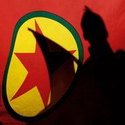 Shadows on the flag of the PKK (photo: AP)