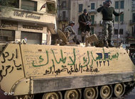 Armoured personnel carrier covered in graffiti in the centre of Cairo (photo: AP)