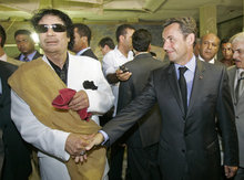 Libyan leader Muammar al-Gaddafi and French President Nicolas Sarkozy (photo: AP)