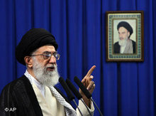 Ali Khamenei infront of Khomeini's picture (photo: AP)