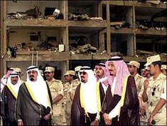 Saudi Crown Prince Abdullah, second left, and other Saudi officials stand in front of a building damaged in a suicide attack, May 13, 2003 (photo: AP)