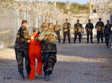 Prisoners and guards in Guantanamo (photo: AP)