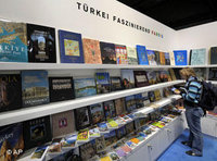 A visitor browses a book at Turkey's booth (photo: AP)