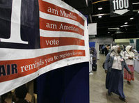 A sign in the bazaar at the 43rd annual ISNA convention in 2006 encourages participants to register to vote (photo: AP)