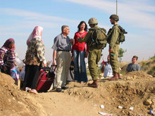 Palestinians and Israeli soldiers at a checkpoint (photo: www.machsomwatch.org)