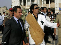 Libyan leader Moammar Qaddafi welcomes French President Nicolas Sarkozy in Tripoli (photo: AP)