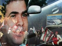 Reflection of Pierre Gemayel on a car window during his funeral (photo: AP) 