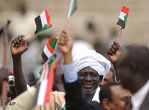 Supporters of the Sudanese Peoples Liberation Movement holding SPLM flags (photo: AP)