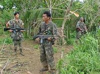 Government troops guard their supply base in the hinterlands of Basilan Island, southern Philippines (photo: AP)