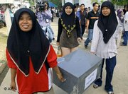 Women carrying a ballot box in the province of Pattani, Thailand – participation and integration will tame radical Islamism in Southeast Asia, experts say (Photo: AP)