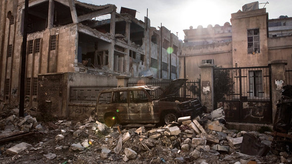 Zerstörte Häuser in der umkämpften Stadt Aleppo; Foto: picture alliance/dpa