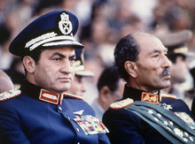 Former president of Egypt Anwar Al-Sadat and president Mubarak during a military parade in 1981 (photo: AP)