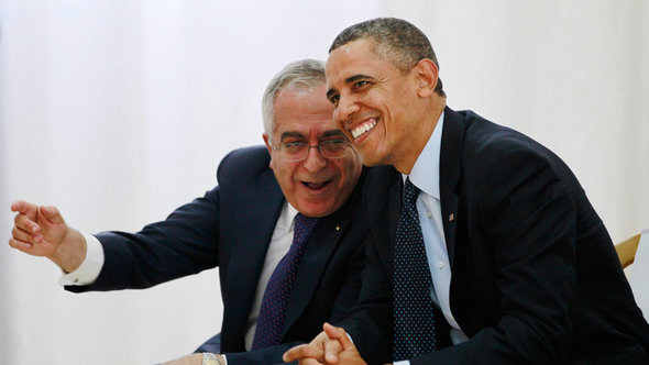 US President Barack Obama watches a cultural event alongside Palestinian Prime Minister Salam Fayyad (photo: Reuters)