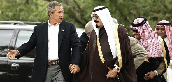 U.S. President Bush and Saudi Crown Prince Abdullah hold hands as they walk at Bush's ranch in Crawford, Texas, in this April 25, 2005 (photo: AP/Gerald Herbert)