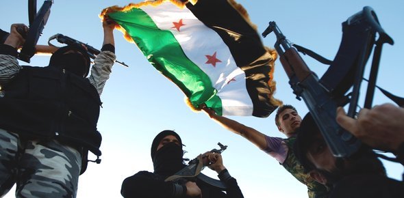 FSA fighters in a suburb of Idlib (photo: AP)