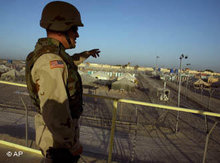 American soldier on an observation tower in Abu Ghraib (photo: AP)