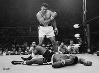 Heavyweight champion Muhammad Ali stands over fallen challenger Sonny Liston, shouting and gesturing, shortly after dropping Liston with a short hard right to the jaw on May 25, 1965, in Lewiston, Maine, USA (photo: AP)