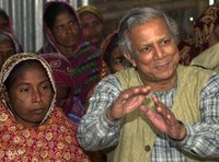 Professor Mohammad Yunus, founder of Grameen Bank, explains to villagers the benefits of the system (photo: AP)
